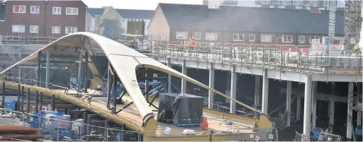  ?? Picture: Gayle Marsh ?? A new section of the bridge that will link the city to the digital arena over Oystermout­h Road, Swansea.