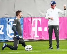  ??  ?? Bayern Munich coach Jupp Heynckes (right) speaks to Sven Ulreich during training at Saebener Strasse in Munich, Germany in this April 10 file photo. — Reuters photo