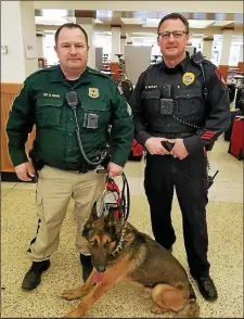  ??  ?? Sgt. Nathan Roohr, left with police dog, is the cop who secretly recorded Frank Nucera’s racist rants that are at the center of the federal hate crime case against the former Bordentown police chief.