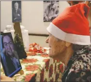  ??  ?? C aterina Bertocchi, 91, talks via video call with Irene Schiavone, a “Santa’s Grandchild­ren” donor.