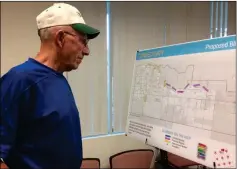  ?? Buy this photo at YumaSun.com PHOTO BY MARA KNAUB/YUMA SUN ?? MARTY HOGANSON CHECKS OUT A MAP OF proposed bikeways during an open house held Thursday. The city is seeking input for the Yuma Bikeways Plan 2018.