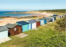  ??  ?? A row of 44 colourful beach huts are strung along the shore at Hopeman, set back on a rise of marram grass.