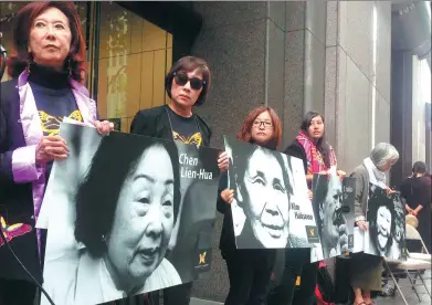  ?? XU YONG / XINHUA ?? Protesters hold photos of “comfort women” in front of the Japanese consulate in San Francisco on Monday, the day designated to remember women forced into sexual slavery before and during World War II by the Imperial Japanese Army.