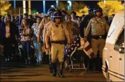  ?? GINA FERAZZI / LOS ANGELES TIMES ?? California Highway Patrol officers escort the body of fallen CHP Officer Andre Moye, 34, after he was killed during a traffic stop Monday.