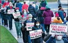  ?? MARK LENNIHAN / AP ?? Nurses at Montefiore New Rochelle Hospital go on strike over safestaffi­ng issues during the COVID- 19 pandemic in New Rochelle, New York, on Tuesday.
