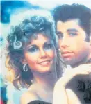  ??  ?? Olivia Newton-John with John Travolta in the 1970s movie