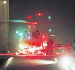  ?? Robert Gauthier
Los Angeles Times ?? A CAR CRASH victim is wheeled from a helicopter, a transporta­tion system introduced in 2003 for drive times that would have exceeded 30 minutes.