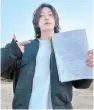 ?? Captured from Daud Kim’s YouTube ?? Korean Muslim YouTuber Daud Kim, or Kim Jae-han, holds a contract for the land property he purchased in Incheon, April 11, in this undated photo.