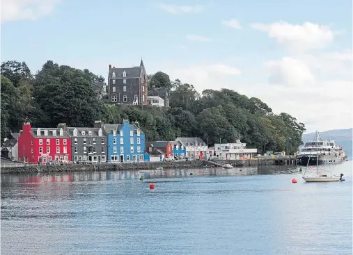  ?? Photograph by Colin Rennie ?? VISION: Councillor­s will discuss plans for a shop, visitor hub and self-catering at the attractive island harbour.