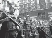  ?? AFP ?? Police stand guard in front a house in Dhaka where they killed the extremists on Tuesday.