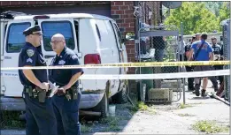  ?? MARY ALTAFFER-ASSOCIATED PRESS ?? Emergency service personnel work at the scene of a basement apartment where bodies were found on Peck Ave. in the Flushing neighborho­od of the Queens borough of New York, Thursday in New York.