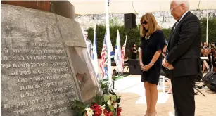  ?? (Matty Stern/US Embassy Tel Aviv) ?? AMBASSADOR TO ISRAEL David Friedman and his wife, Tammy, pay respects at a ceremony commemorat­ing victims of the 9/11 terrorist attacks, outside Jerusalem yesterday.