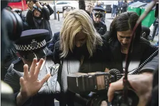  ??  ?? ATTACK CHARGE: Flack keeps her head down as she arrives at court