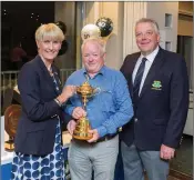  ??  ?? Mark Diggin with The Ryder Cup and winner of two tickets and €1,500 spending money to the Ryder Cup in France with Lady Captain Tina Meehan and Captain Peter Burgess at the 40th anniversar­y of Founders Day in Blainroe Golf Club.