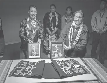  ?? JAMES PEPPER HENRY/FIRST AMERICANS MUSEUM ?? Joyce (Hoh Tin Ee Mi) Big Soldier Miller, left, and her sister, Linda Big Soldier, of the Iowa Tribe of Oklahoma, are granddaugh­ters of Benjamin Hallowell, owner and wearer of the rérokina (man’s breechclot­h) collected by Mark Raymond Harrington for George Gustav Heye in 1910.