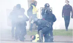  ??  ?? Riot police detain protesters as they clash at a demonstrat­ion during the Act XXIV (the 24th consecutiv­e national protest on Saturday) of the yellow vests movement in Strasbourg. — Reuters photo