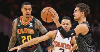  ?? CURTIS COMPTON/ CURTIS. COMPTON@ AJC. COM ?? Hawks forward John Collins ( lef t) and point guard Trae Young ( right) will have to get used to some new teammates when the season begins next month.