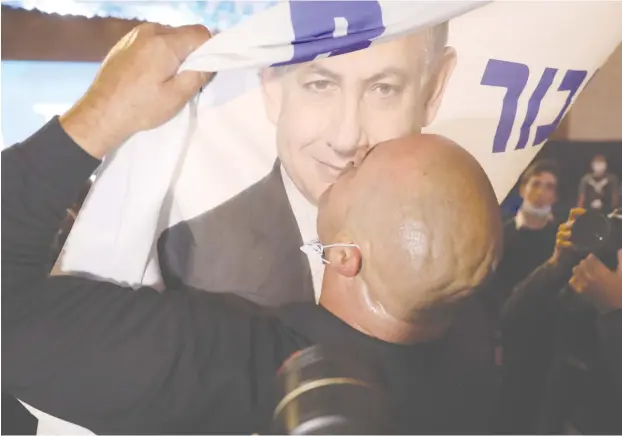  ?? (Marc Israel Sellem/The Jerusalem Post) ?? KISSING NETANYAHU goodbye, or welcoming him for another round as prime minister? Time will tell.