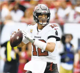  ?? JASON BEHNKEN/AP ?? Tom Brady became the first player to throw 600 career TDs, reaching the milestone during the Buccaneers’ victory over the Bears on Sunday.