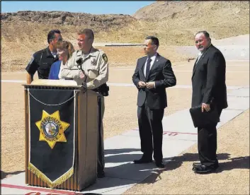  ?? Mike Shoro Las Vegas Review-Journal ?? Clark County Undersheri­ff Kevin McMahill, third from left, speaks Thursday at an announceme­nt of local law enforcemen­t’s plans to create a shared training facility in Las Vegas.