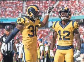  ?? KYLE TERADA/USA TODAY SPORTS ?? Wide receiver Brandin Cooks (12) scored one TD and running back Todd Gurley (30) had two as the Rams routed the 49ers to remain undefeated.