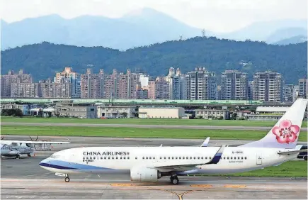  ?? DAVID CHANG/EPA-EFE ?? Through the years, Boeing has delivered 1,045 types of 737 aircraft to China, such as this China Airlines Boeing 737-8BL parked at Taipei Songshan Airport in January.