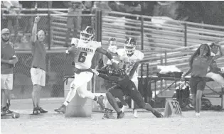  ?? GERALD LEONG/ORLANDO SENTINEL ?? Edgewater senior Christian Leary returns a punt for a touchdown Friday night during a 31-24 win at Kissimmee Osceola. The Eagles were seeing their first action since Sept. 25 after being forced to quarantine.