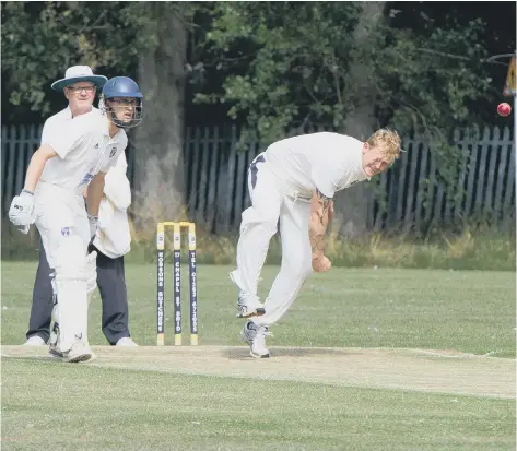  ??  ?? Filey all-rounder Josh Dawson in bowling action for the 2019 Beckett League champions