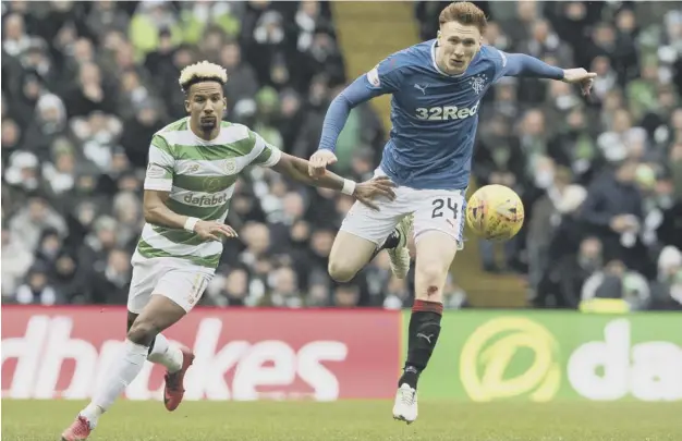 ??  ?? 0 David Bates beats Scott Sinclair to the ball during an impressive performanc­e at Celtic Park where he came on as an early replacemen­t for defender Bruno Alves.
