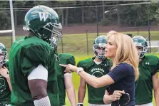  ?? WARNER BROS. ?? Leigh Anne Tuohy (Sandra Bullock) gives her adopted son Michael Oher (Quinton Aaron) a pep talk in The Blind Side.
