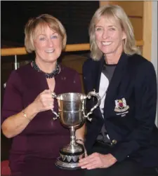  ??  ?? Marie MacKell receives the Rawson Cup from Lady Captain Maeve Ahern.