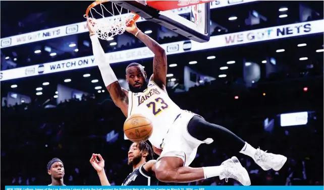  ?? — AFP ?? NEW YORK: LeBron James of the Los Angeles Lakers dunks the ball against the Brooklyn Nets at Barclays Center on March 31, 2024.