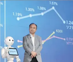  ?? TOSHIFUMI KITAMURA/AFP/GETTY IMAGES ?? Masayoshi Son of SoftBank Group Corp., seen with the company’s robot “Pepper”, is among Asia’s biggest tech companies with billionair­e founders who have all-male boards.