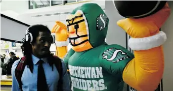  ?? Paul Chiasson /The Canadian Press ?? Hamilton DB Courtney Stephen with a Roughrider­s blow-up mascot set up for the Grey Cup.
