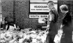  ?? Picture: Basil Kidd ?? Marianne Mcnicholas stands beside Sir Martin Garrod, on the 10th anniversar­y of the bombing; Margaret Thatcher, accompanie­d by Commandant General Sir Martin Garrod, who died in 2009, takes in the floral tributes laid at the south barracks gate in 1989 after the bombing at the School of Music