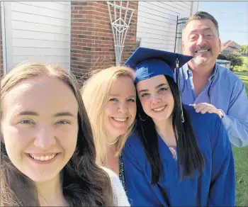  ?? GROBMEIER FAMILY ?? From left, Sam, Cyndi, Maddie “Maddog” and Frank Grobmeier pause for a family photo in 2019 on Maddie’s high school graduation day.