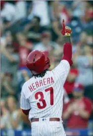 ?? LAURENCE KESTERSON — THE ASSOCIATED PRESS ?? Philadelph­ia Phillies outfielder’ Odubel Herrera gestures after hitting a home run during the third inning of Saturday’s game against the Washington Nationals.