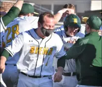  ?? BY KYLE ADAMS KADAMS@MEDIANEWSG­ROUP.COM @KASPORTSNE­WS ON TWITTER ?? Siena celebrates after Wille Schwarick hit a walk-off, mercy rule home run in the first at-bat of his college baseball career.