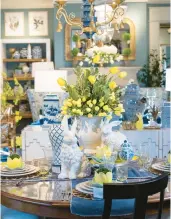  ?? ?? This tablescape takes a less expected approach with pops of citrus tones that pair perfectly with blue and white.
outdoor pillows will do.