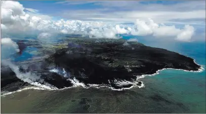  ?? LE Baskow ?? The Associated Press Most of the Kapoho area including the tide pools is now covered in fresh lava with few properties still intact as the Kilauea volcano lower east rift zone eruption continues in Pahoa, Hawaii.