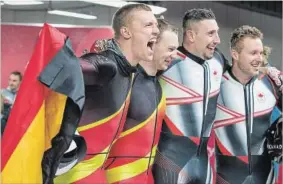  ?? ANDREAS RENTZ GETTY IMAGES ?? Gold-medallists Thorsten Margis and Francesco Friedrich of Germany and Justin Kripps and Alexander Kopacz of Canada celebrate after their dual two-man bobsleigh victory.