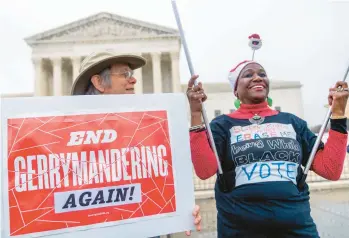  ?? ANDREW HARNIK/AP ?? Activists demonstrat­e Wednesday during a case concerning North Carolina Republican­s’ efforts to draw congressio­nal districts heavily in their favor that were blocked by a Democratic majority on the state Supreme Court.