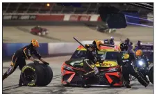  ?? (AP/John Amis) ?? Martin Truex Jr. pits during Sunday’s NASCAR Cup Series race in Darlington, S.C. Truex was moved to back of the pack with 36 laps remaining when he came into the pits too fast. He finished fourth.