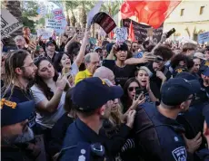  ?? — AFP photo ?? Israeli police disperse a protest calling for a ceasefire and for the release of Israeli hostages held in Gaza in the northern port city of Haifa.