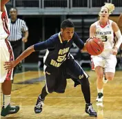  ?? CHARLES TRAINOR JR. ctrainor@miamiheral­d.com, file 2010 ?? George Washington University’s Kye Allums plays against UM in 2010. Allums was one of the first openly transgende­r athletes to compete in Division I women’s basketball.