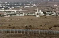  ?? (Marc Israel Sellem/The Jerusalem Post) ?? A TOWN in southern Syria as seen from the Israeli border.