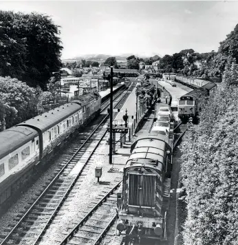  ??  ?? The lack of motorways made the West Country a popular destinatio­n for Motorail services, with St Austell being the main hub for Cornwall. This view on July 15, 1977 shows a hive of activity as No. 08576 shunts wagons for unloading after arriving from Olympia behind No. 50022 (right), while No. 50028 (left) arrives at the head of the 09.35 Paddington-Penzance. Brian Morrison