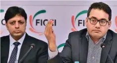  ??  ?? Snapdeal CEO Kunal Bahl (R) and Amazon’s Country Head Amit Agarwal (L) address a press meet organised by FICCI on e-commerce industry in India, in New Delhi on Thursday