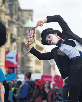  ?? Photograph: Julie Howden ?? A street performer at the Fringe