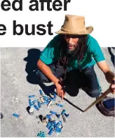  ??  ?? Judah Square community leader Brother Maxi with some of the rubber bullets and spent grenades used by police as they left with their confiscate­d bounty.